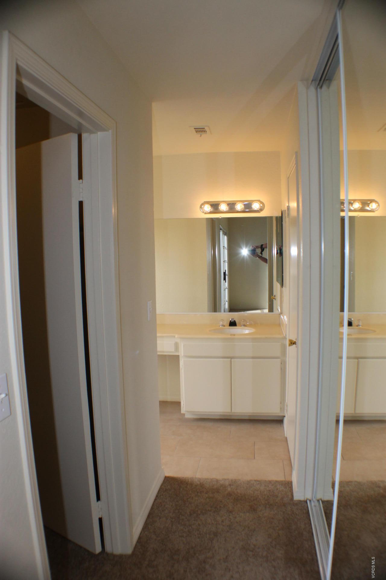 1878 Rory Lane, Unit 2 Simi Valley, CA 93063 - Photo 17 of 30 a bathroom with a bathtub a sink and a mirror