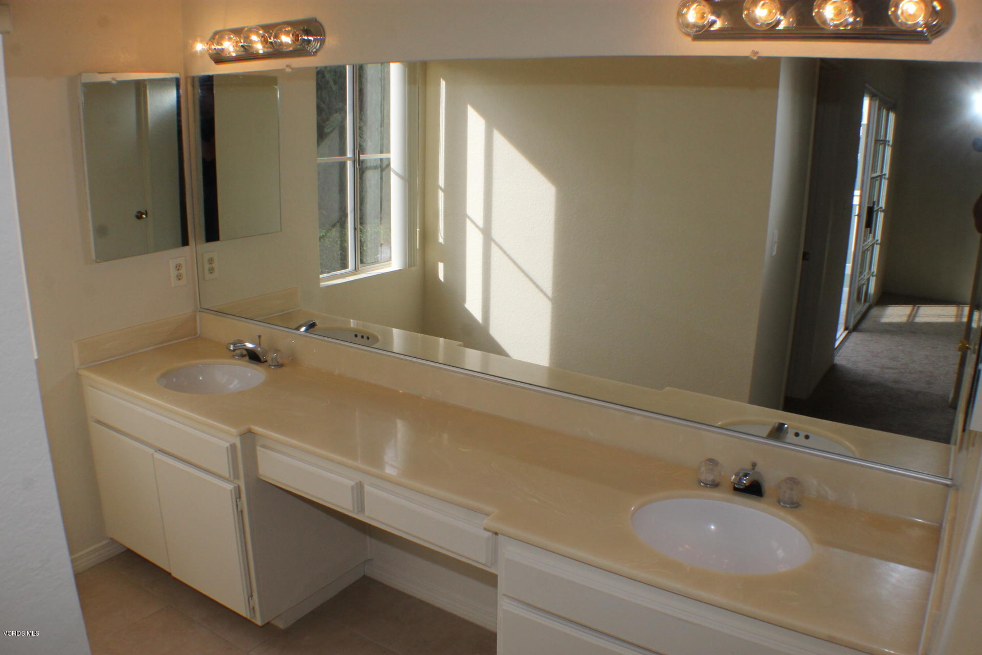 1878 Rory Lane, Unit 2 Simi Valley, CA 93063 - Photo 19 of 30 a bathroom with a sink and a mirror