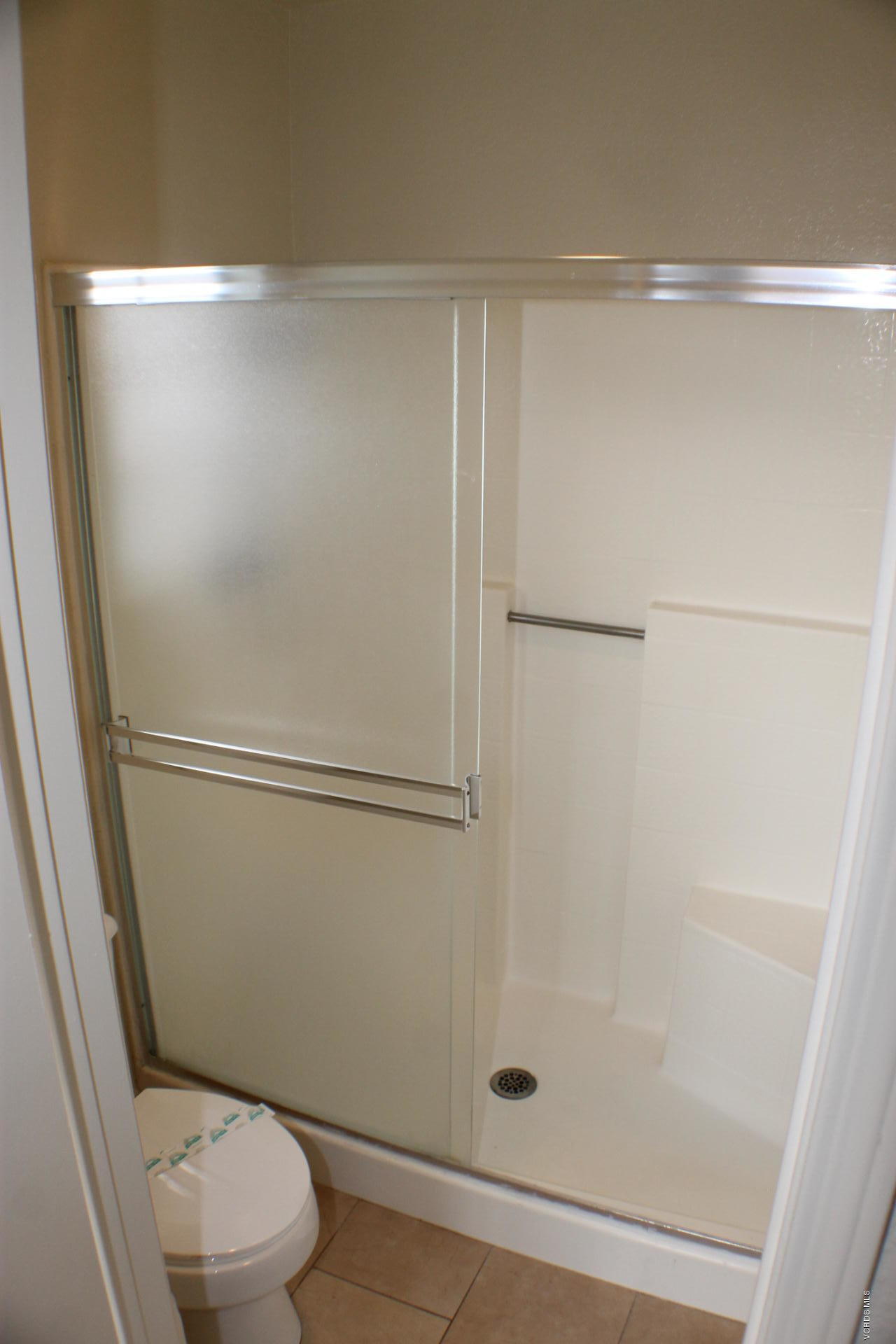 1878 Rory Lane, Unit 2 Simi Valley, CA 93063 - Photo 20 of 30 a bathroom with a shower and a toilet