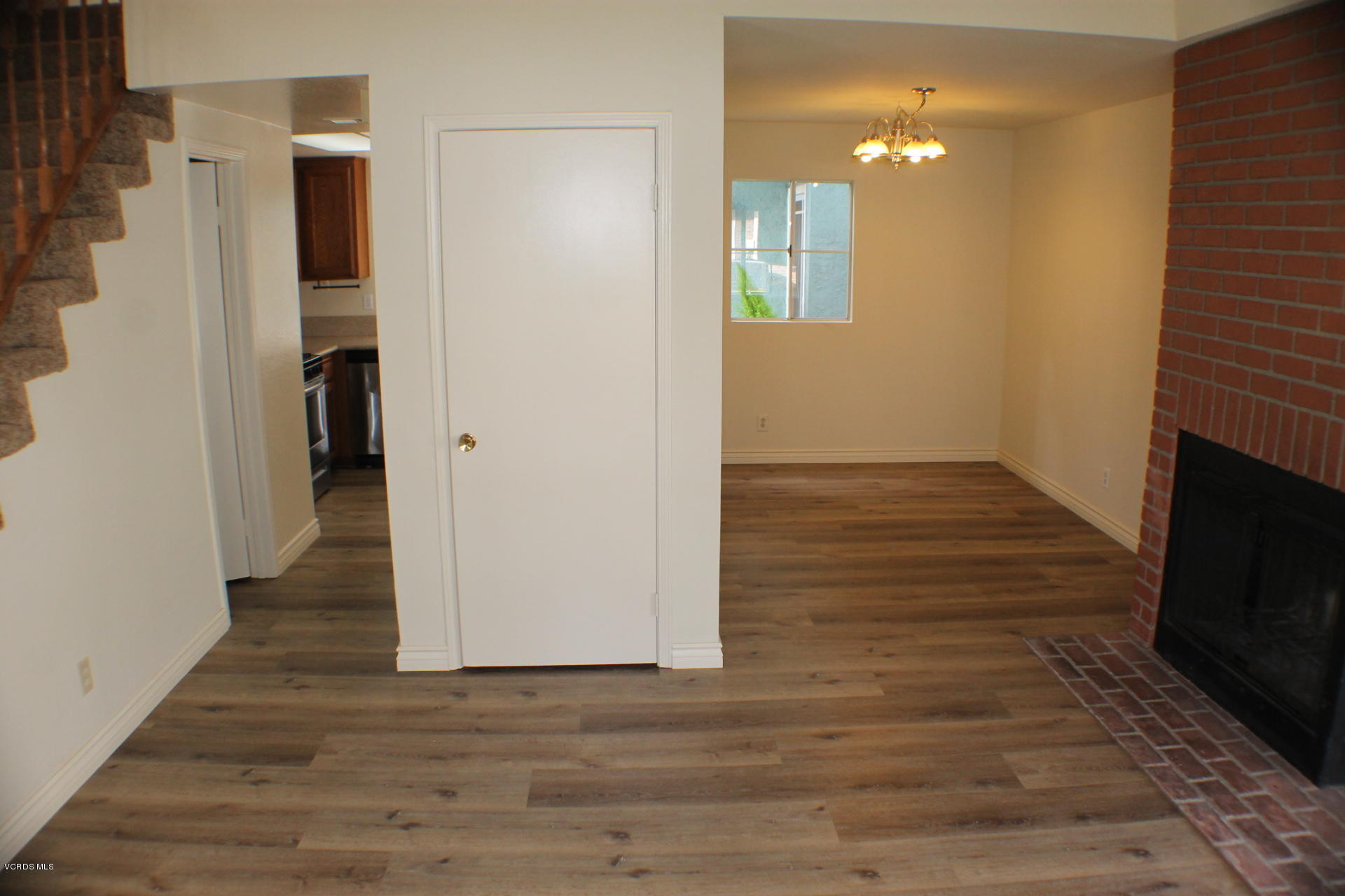 1878 Rory Lane, Unit 2 Simi Valley, CA 93063 - Photo 3 of 30 a view of hallway with wooden floor and stairs