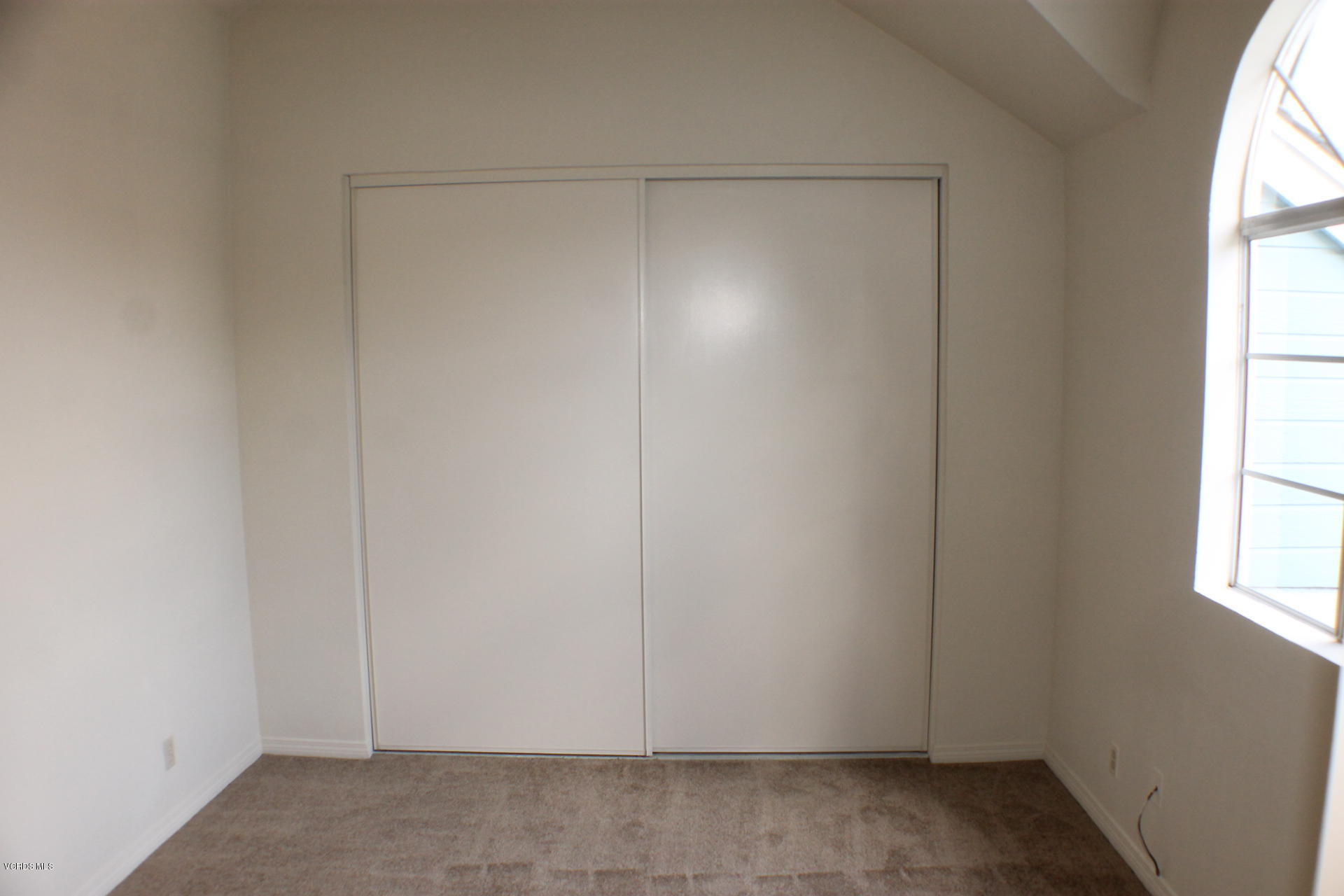 1878 Rory Lane, Unit 2 Simi Valley, CA 93063 - Photo 21 of 30 a view of an empty room with a window