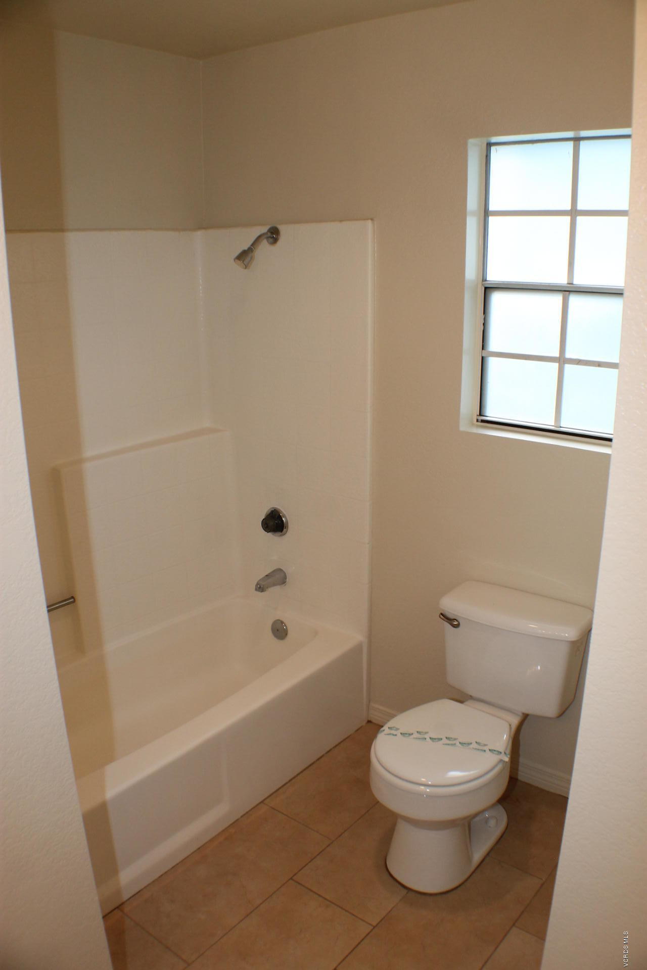 1878 Rory Lane, Unit 2 Simi Valley, CA 93063 - Photo 27 of 30 a white toilet sitting next to a bath tub