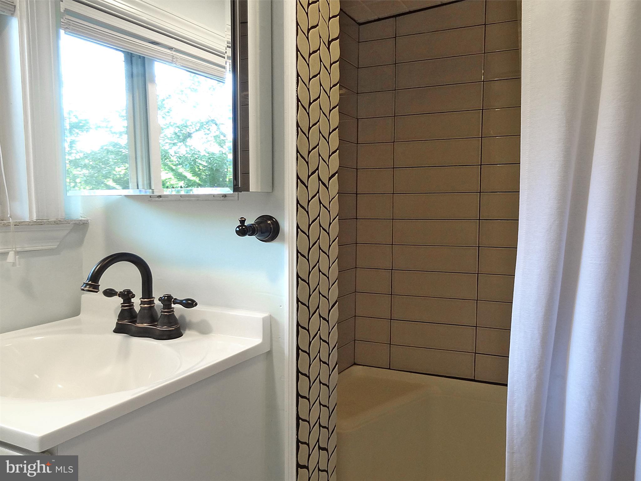 895 Woods Road Pasadena, MD 21122 - Photo 17 of 27 REMODELED UPPER FULL BATH