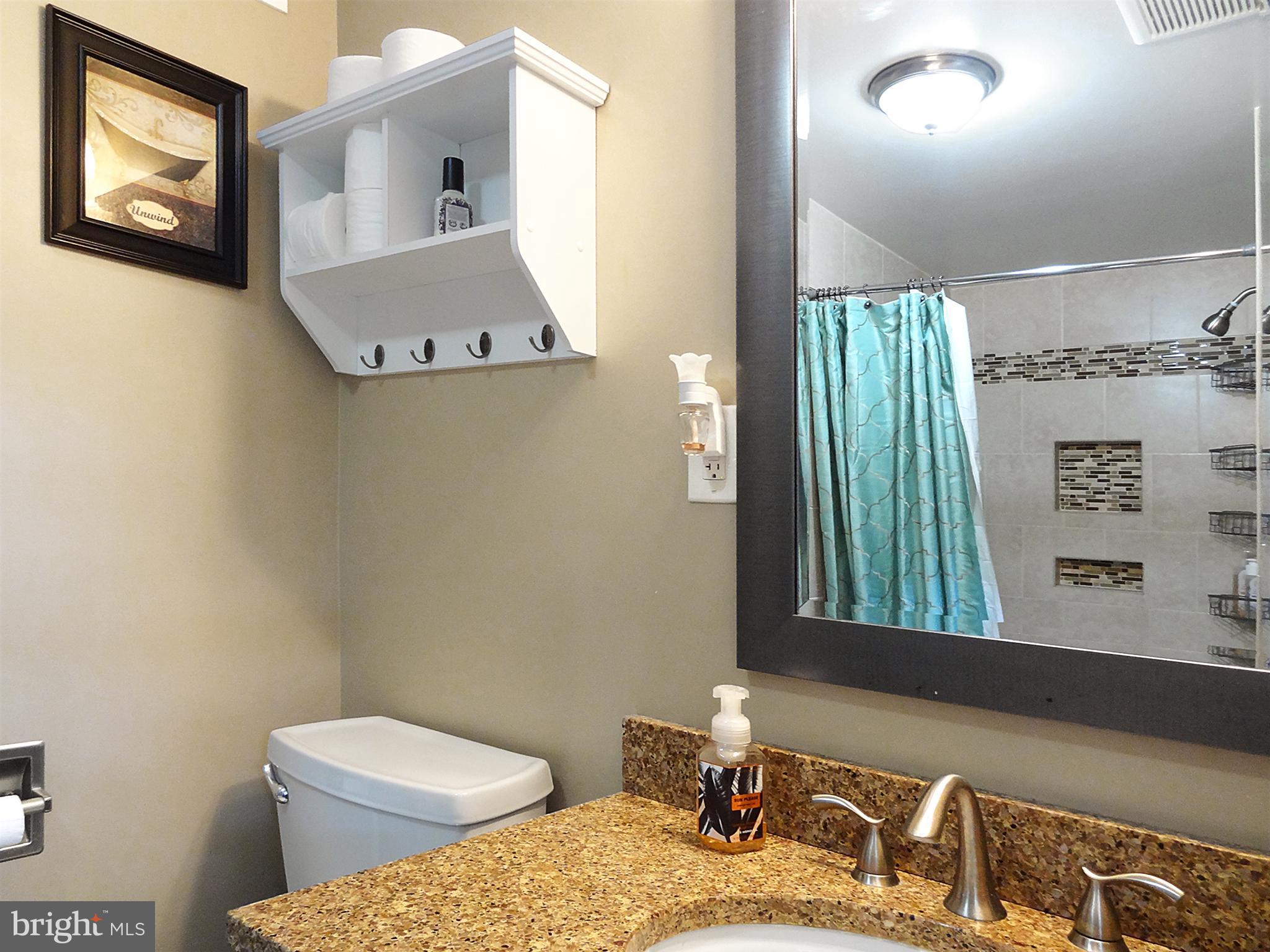 895 Woods Road Pasadena, MD 21122 - Photo 21 of 27 CUSTOM TILE SURROUND SHOWN IN MIRROI