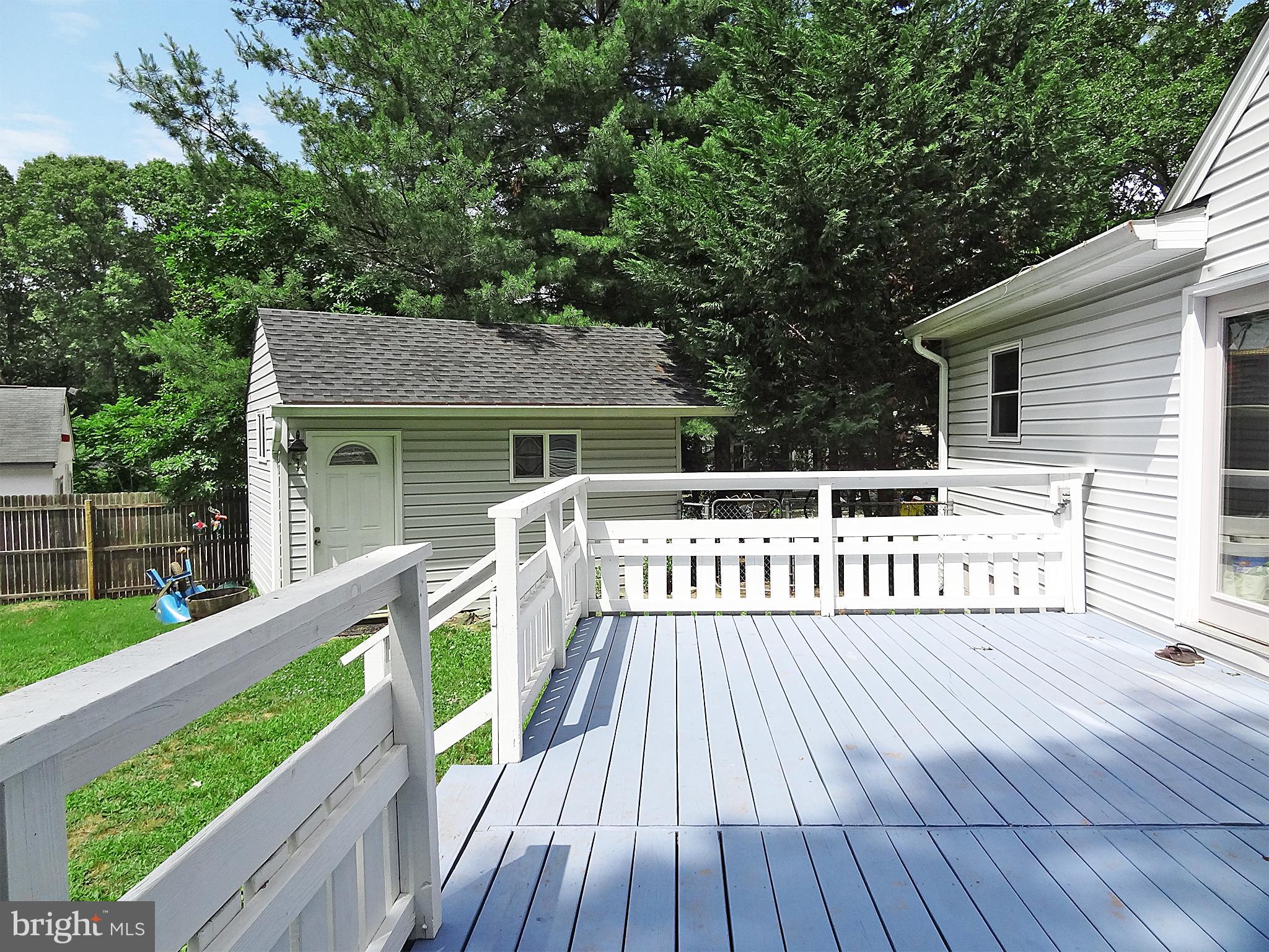 895 Woods Road Pasadena, MD 21122 - Photo 7 of 27 LARGE BACK DECK OVERLOOKING BACKYARD