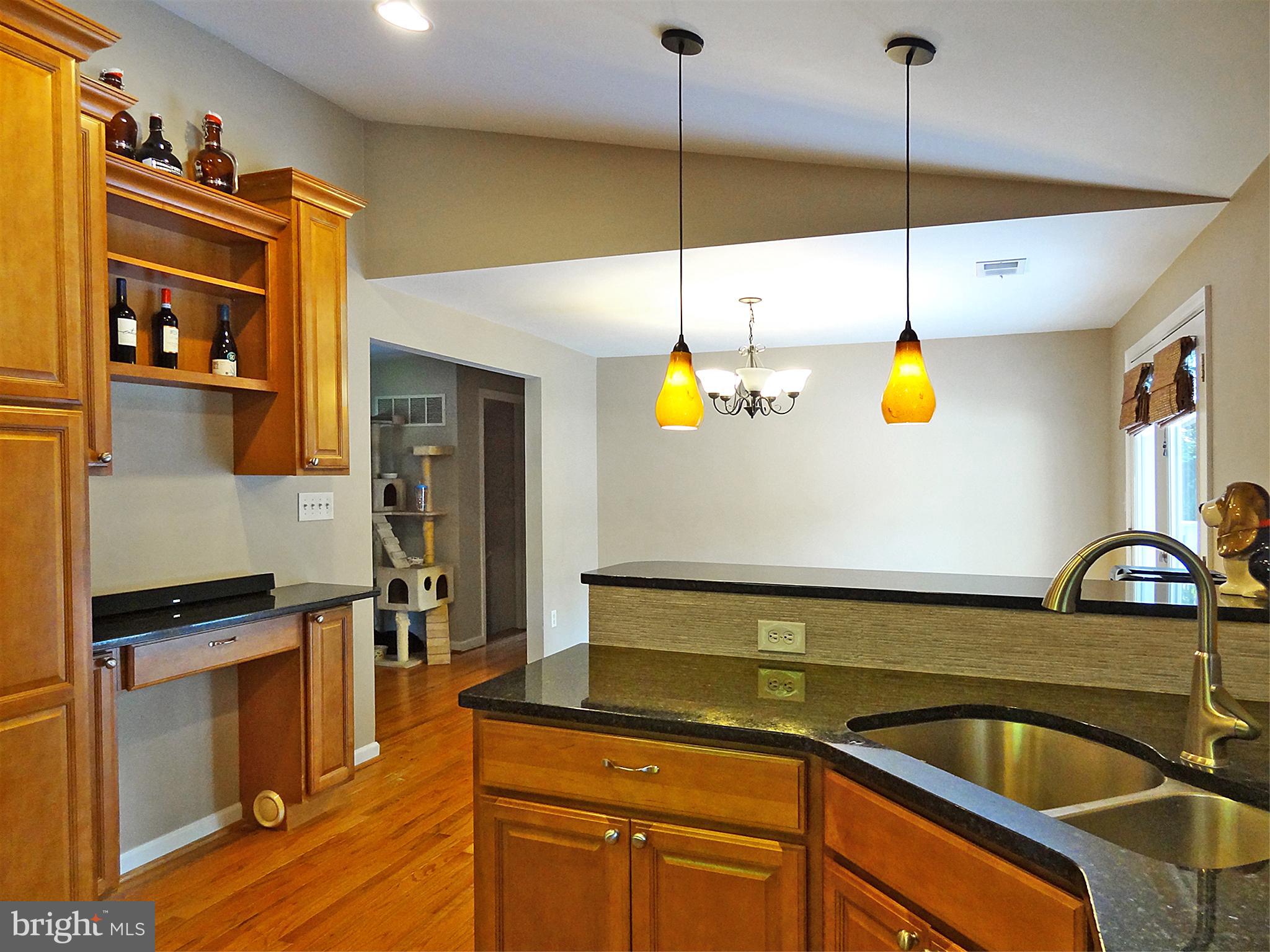 895 Woods Road Pasadena, MD 21122 - Photo 9 of 27 VAULTED KITCHEN AND PENCIL MARBLE TILE BACKSPLASH