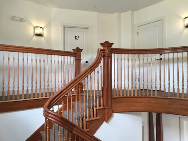 a view of a balcony with wooden floor
