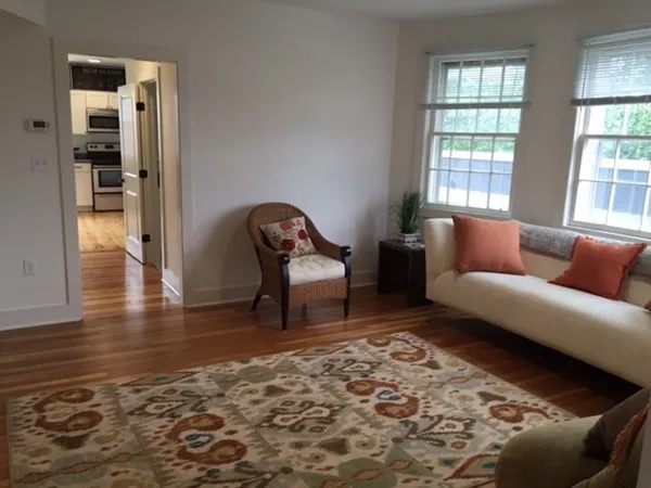 a living room with furniture and a rug