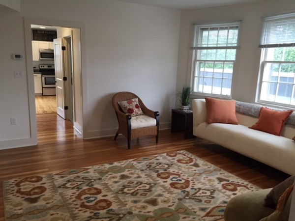 89 Main Street, Unit 12 Andover, MA 01810 - Photo 8 of 11 a living room with furniture and a rug