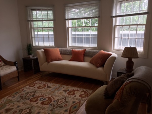 89 Main Street, Unit 12 Andover, MA 01810 - Photo 10 of 11 a living room with furniture and a window
