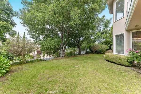 a view of a trees in front of a house