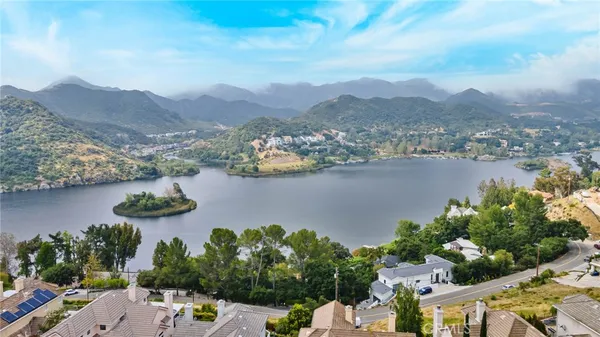 an aerial view of a city with mountains