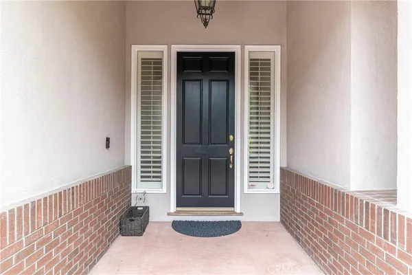 a view of a door and a window
