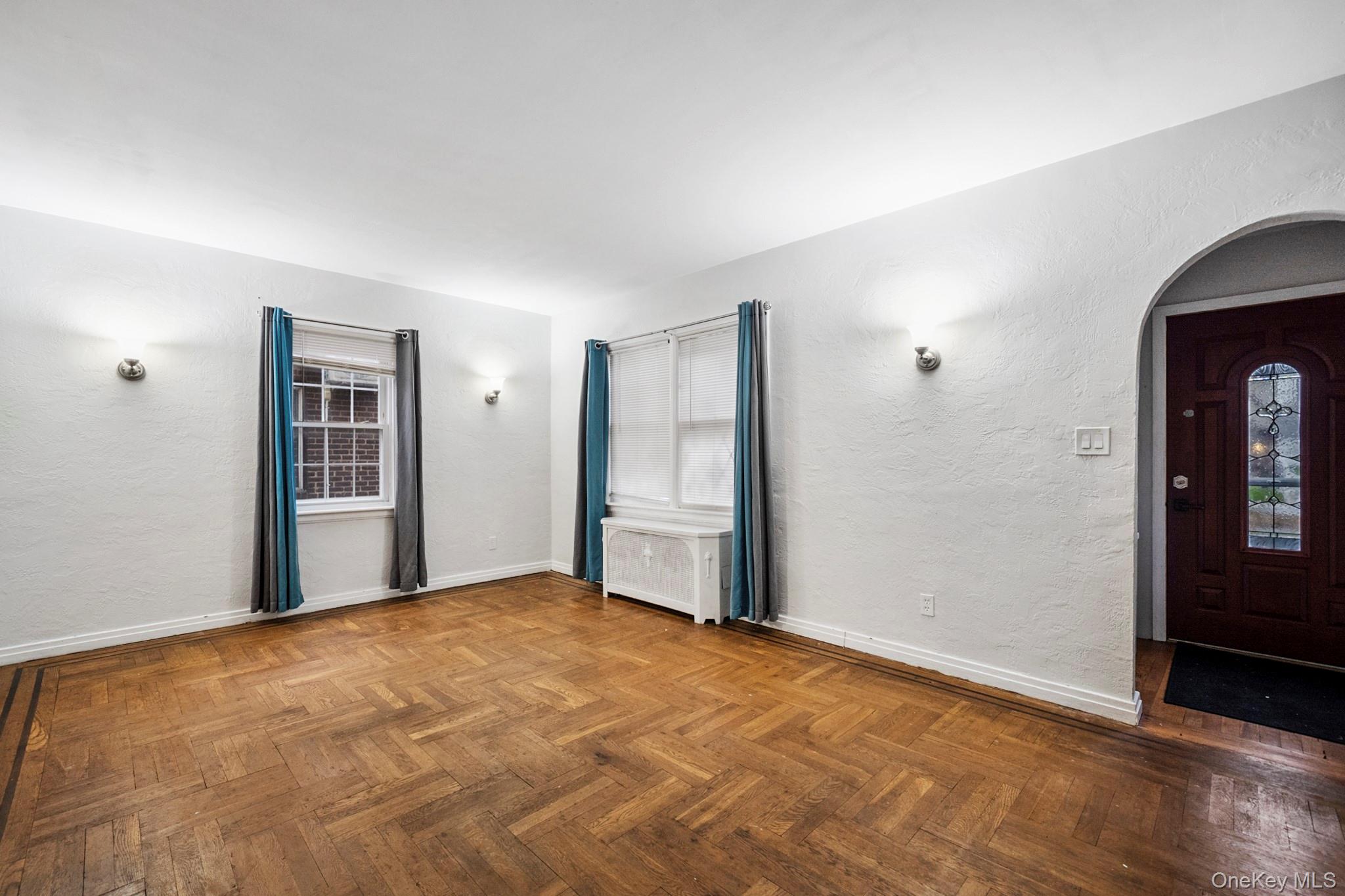 86-33 253rd Street Queens, NY 11426 - Photo 3 of 17 a view of an empty room with closet and a window