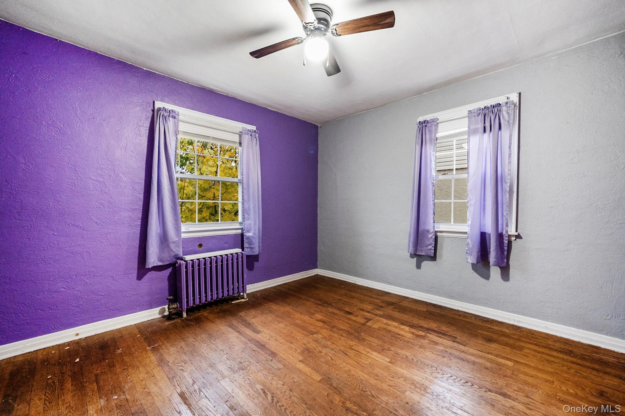 86-33 253rd Street Queens, NY 11426 - Photo 6 of 17 an empty room with windows