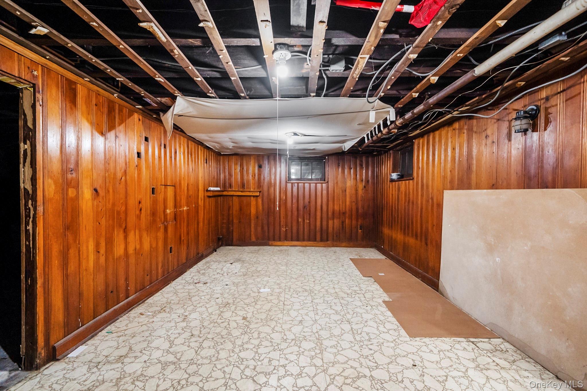 86-33 253rd Street Queens, NY 11426 - Photo 9 of 17 a view of hallway with wooden walls