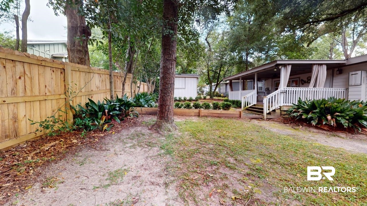 48 Hathaway Road West Mobile, AL 36608 - Photo 33 of 40 View of yard featuring covered porch