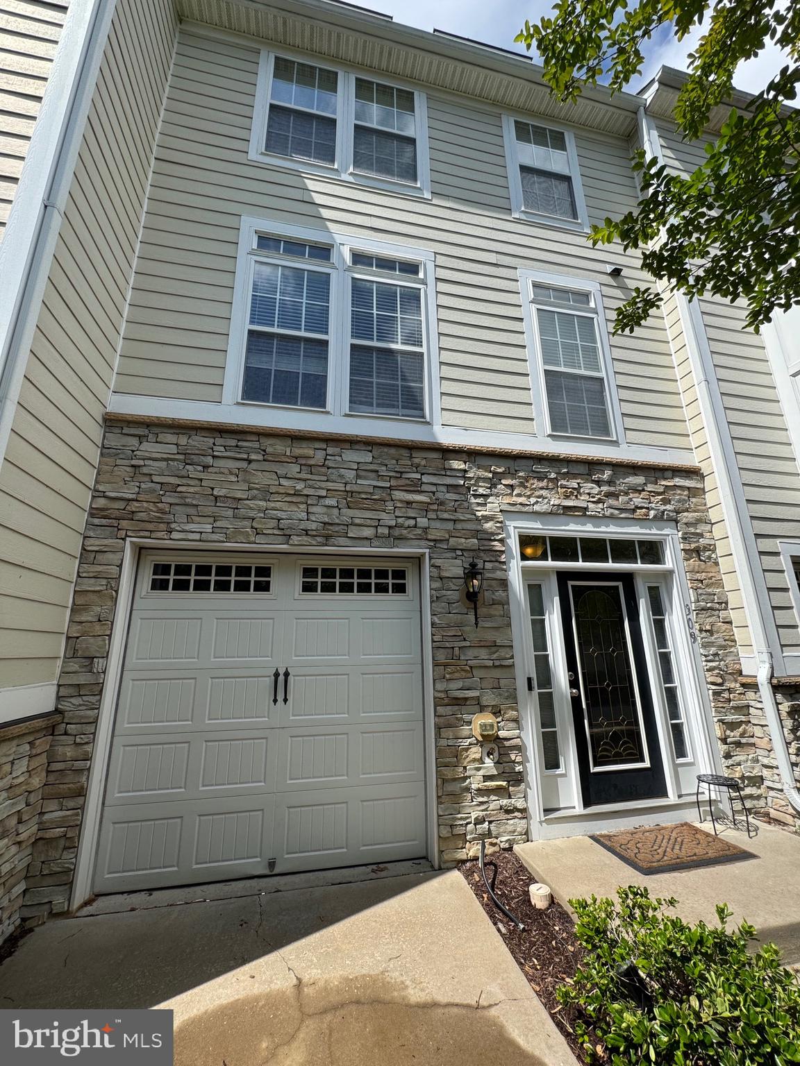 a front view of a house with garage