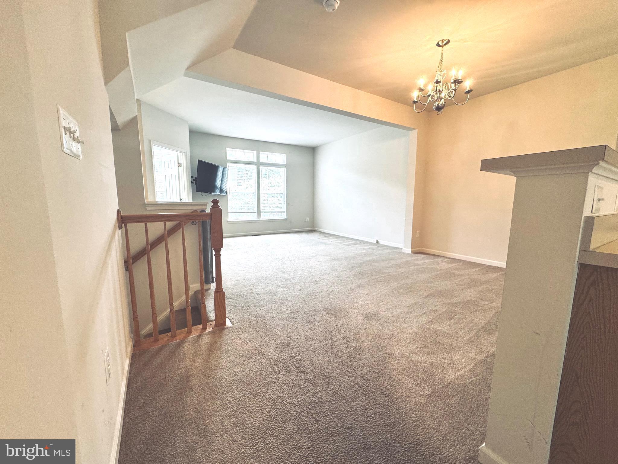 309 Monroe Point Drive Colonial Beach, VA 22443 - Photo 19 of 52 a view of an empty room with a chandelier fan