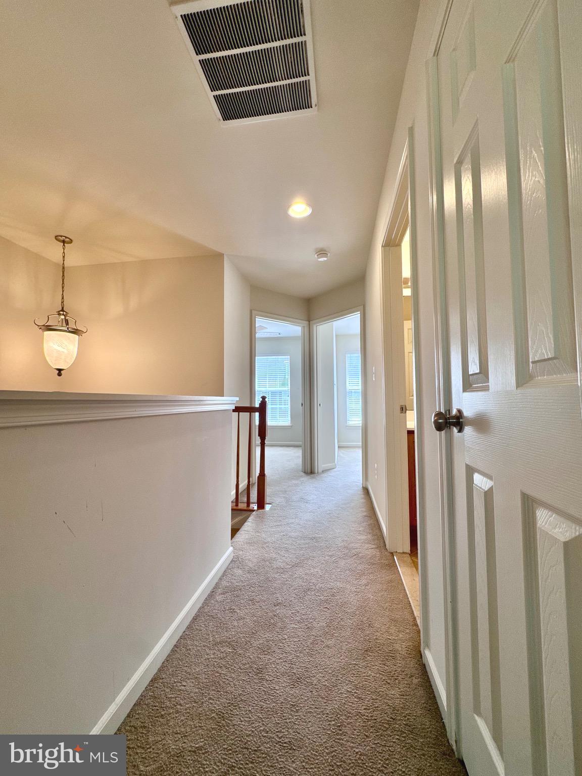 309 Monroe Point Drive Colonial Beach, VA 22443 - Photo 28 of 52 a view of a hallway with windows