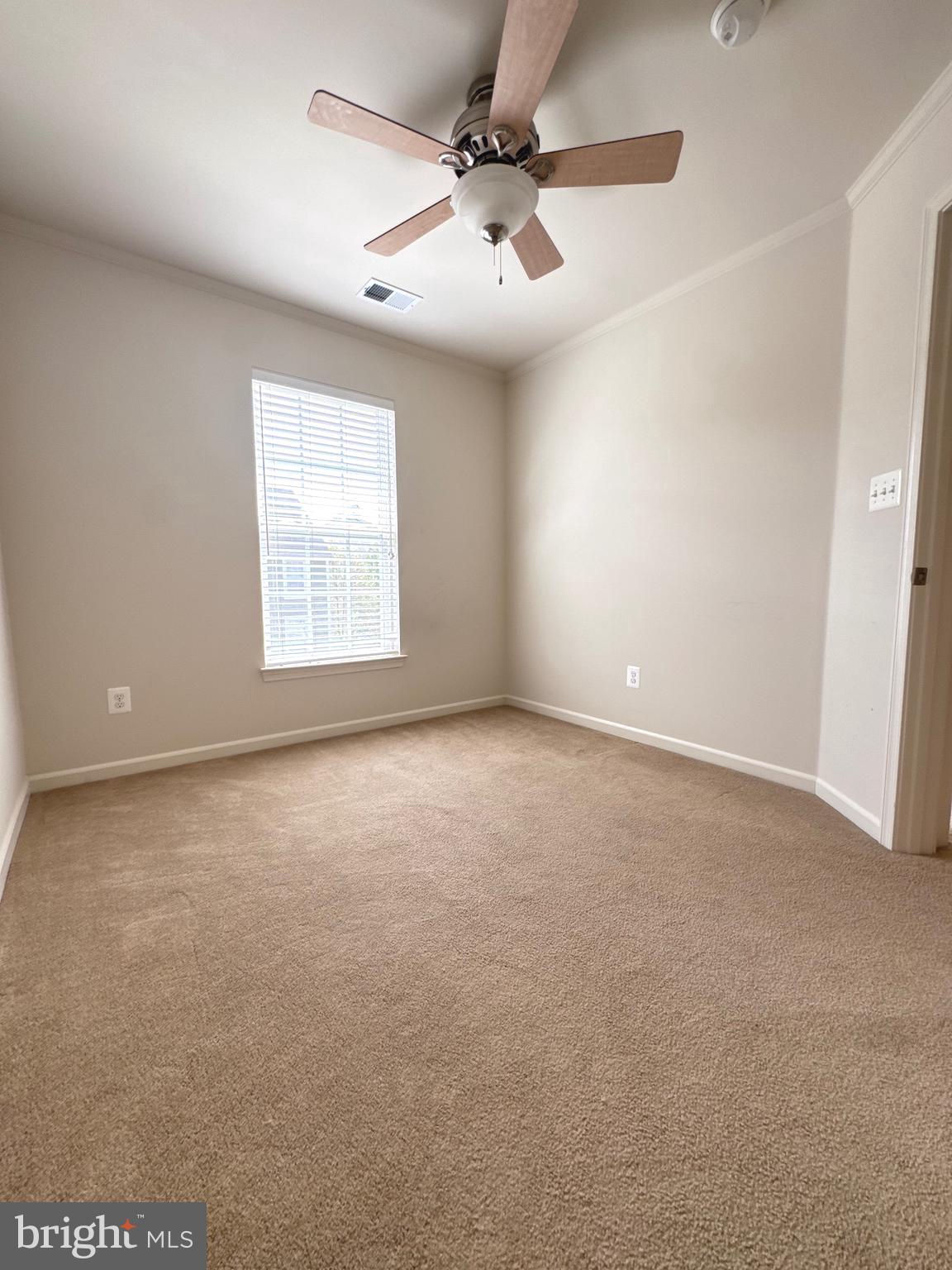 309 Monroe Point Drive Colonial Beach, VA 22443 - Photo 30 of 52 an empty room with windows and fan