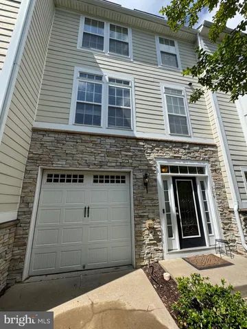 a front view of a house with garage