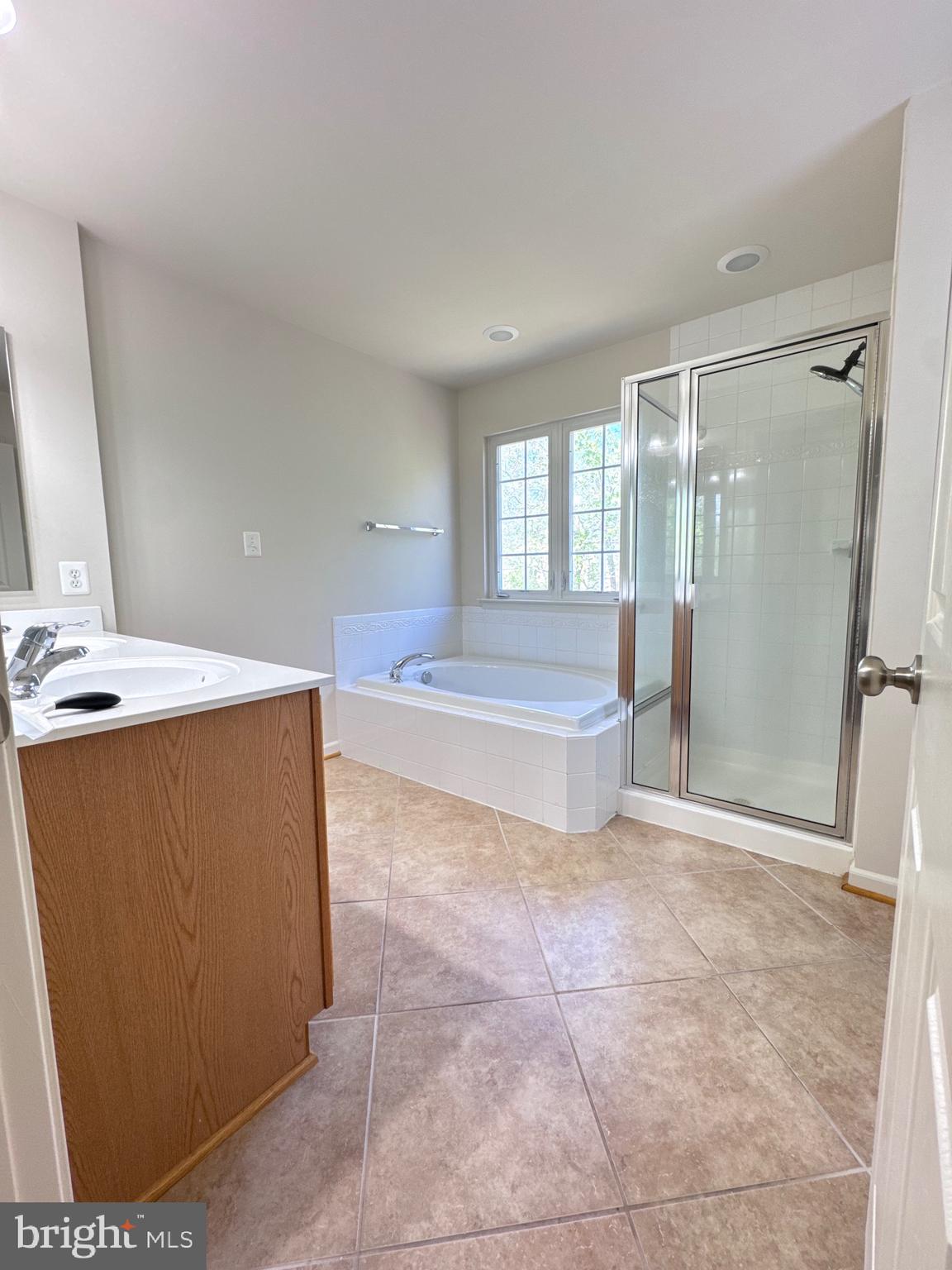 309 Monroe Point Drive Colonial Beach, VA 22443 - Photo 37 of 52 a spacious bathroom with a tub shower and mirror