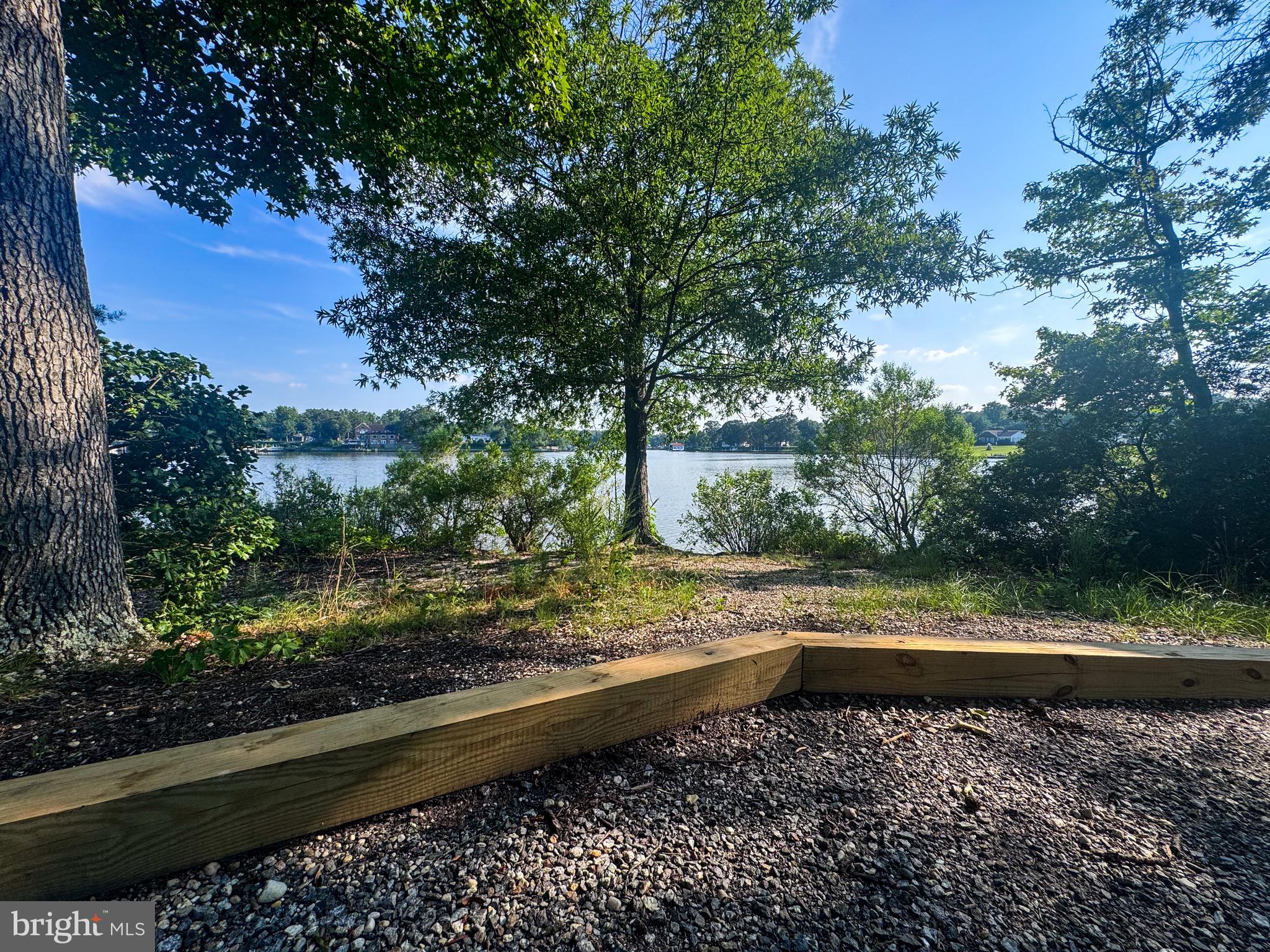309 Monroe Point Drive Colonial Beach, VA 22443 - Photo 49 of 52 a view of a yard with wooden fence