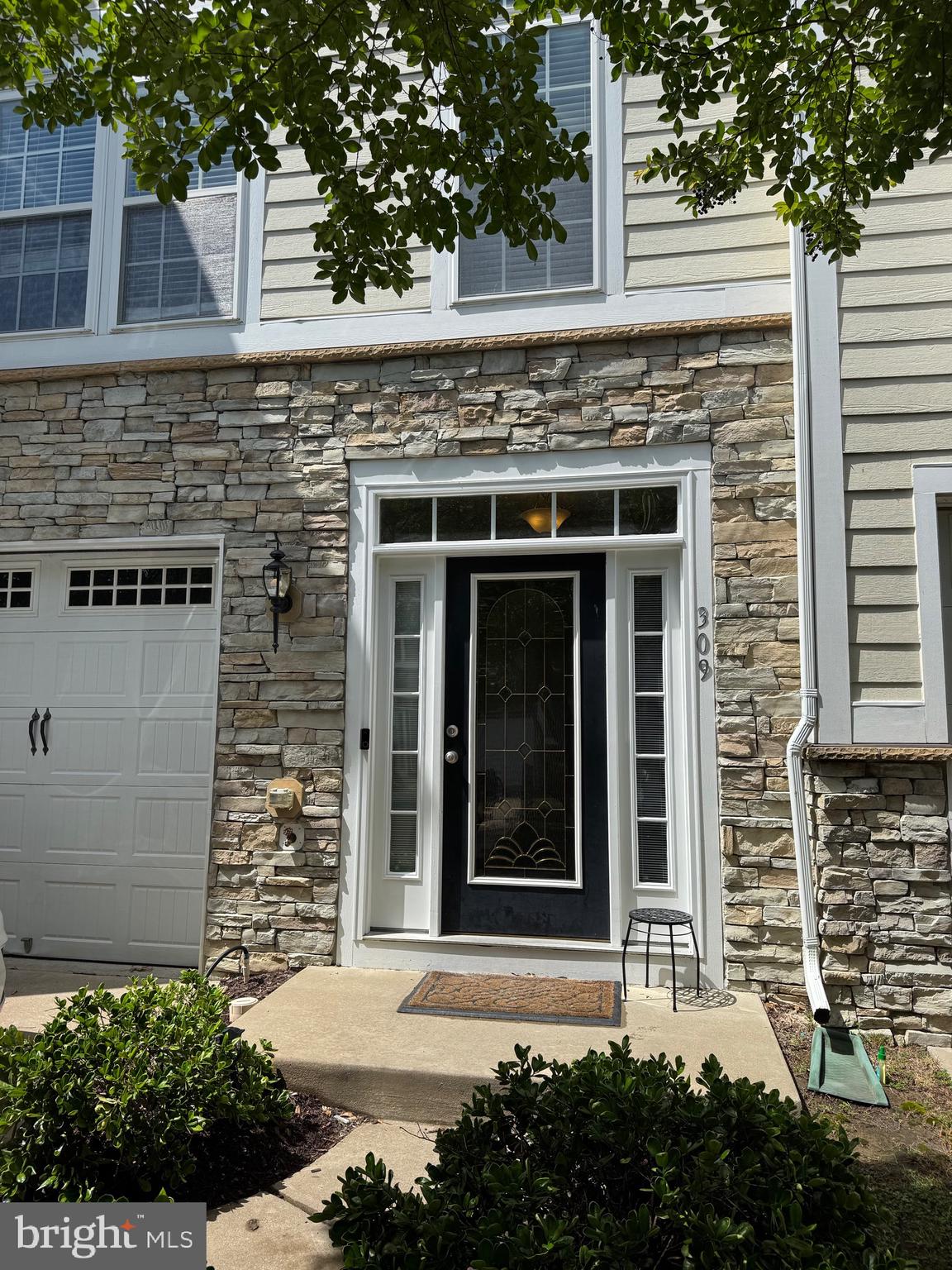 309 Monroe Point Drive Colonial Beach, VA 22443 - Photo 5 of 52 front view of a brick house with a large window