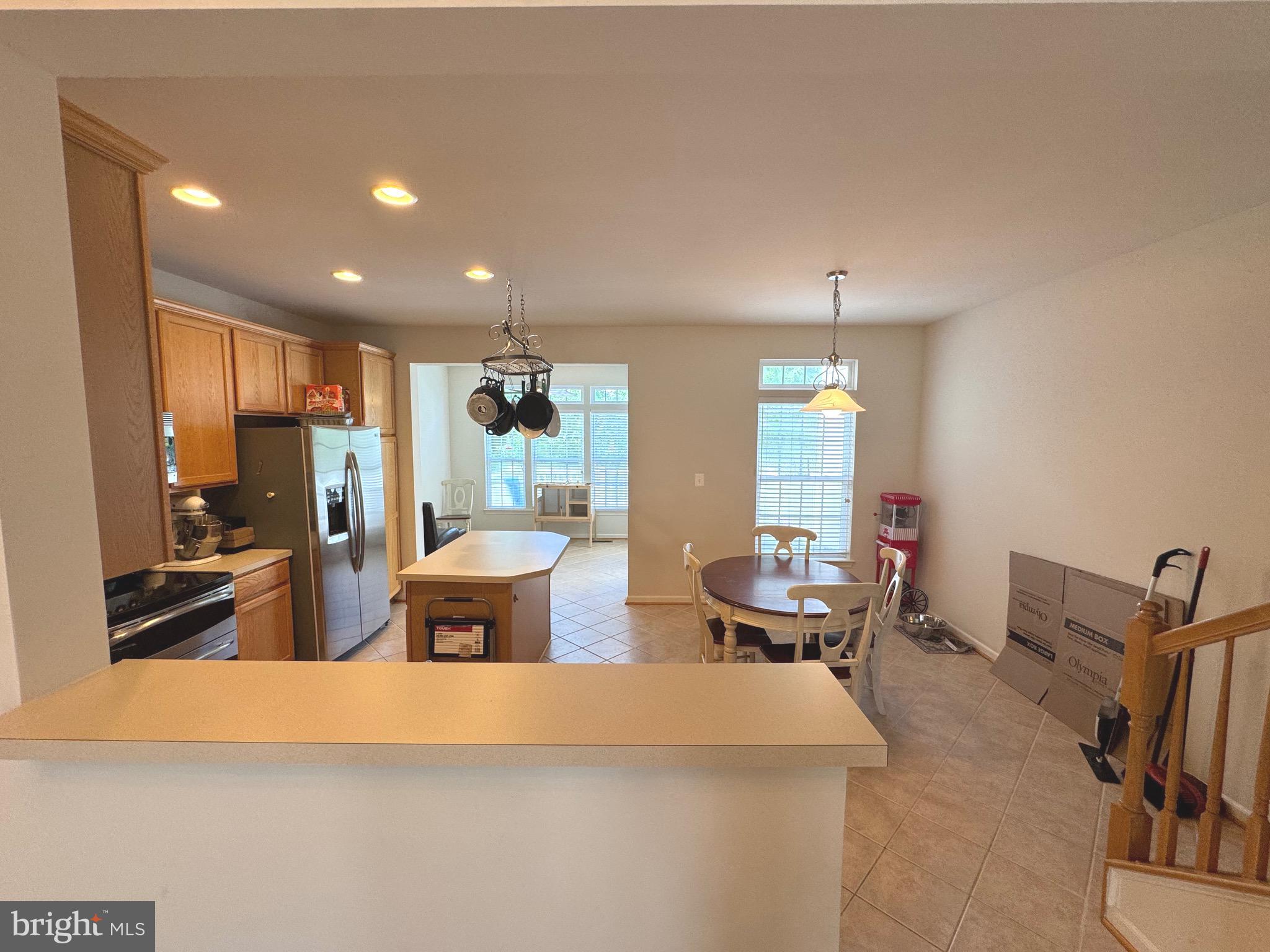 309 Monroe Point Drive Colonial Beach, VA 22443 - Photo 7 of 52 a dining hall with couches a flat screen tv and chairs