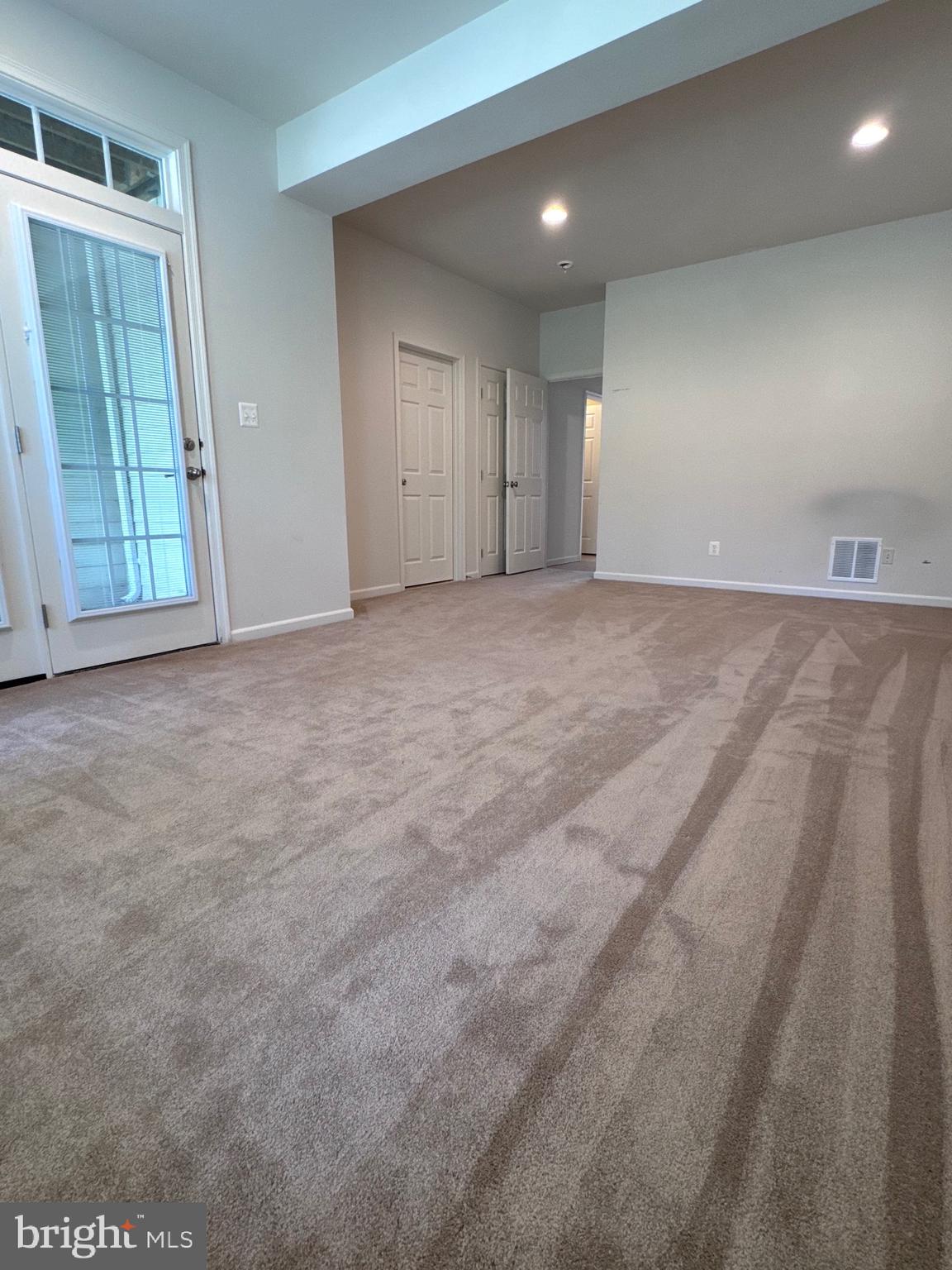309 Monroe Point Drive Colonial Beach, VA 22443 - Photo 10 of 52 a view of an empty room and glass door