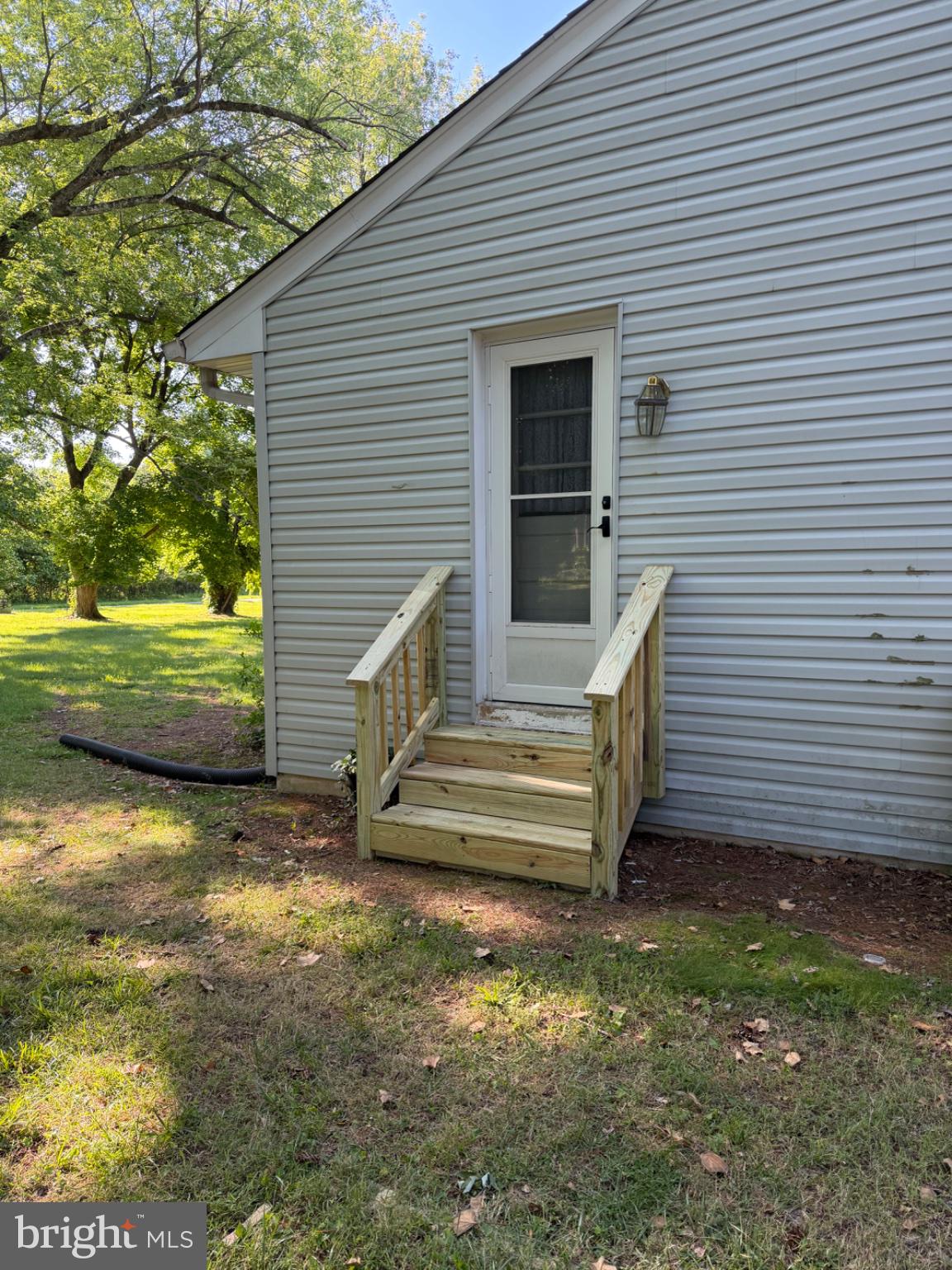 1509 Duvall Road Annapolis, MD 21409 - Photo 5 of 39 a view of a backyard with chairs and a grill