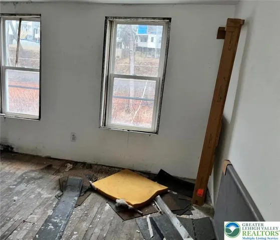 a kitchen with a stove and a refrigerator
