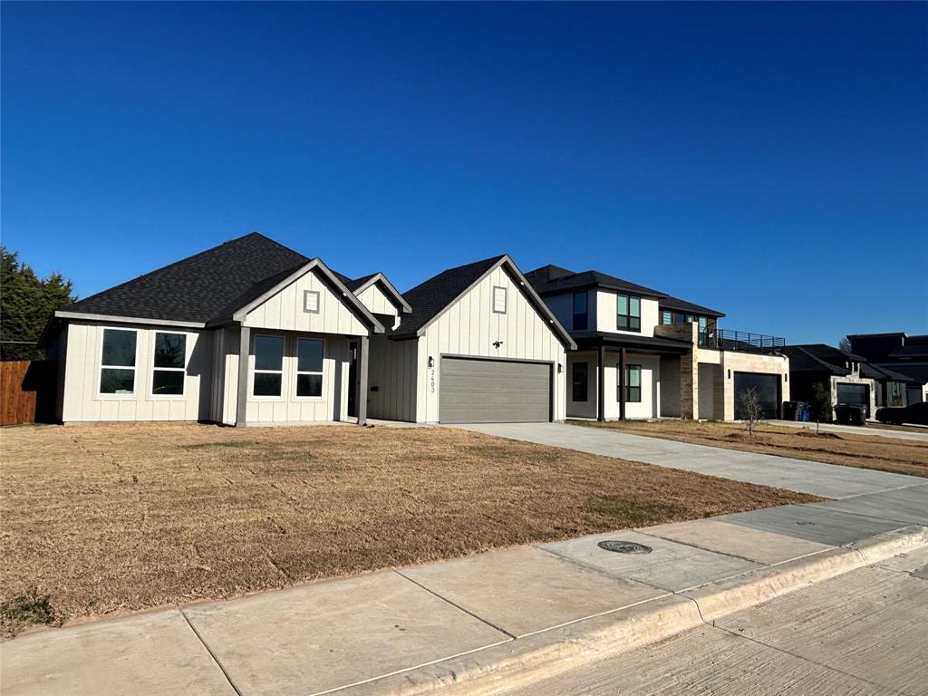 2403 Gooch Street Dallas, TX 75241 - Photo 3 of 3 a front view of a house with a yard