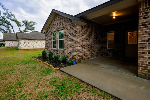 a brick house with a yard