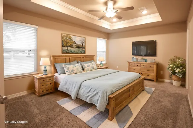 en empty room with windows and chandelier fan