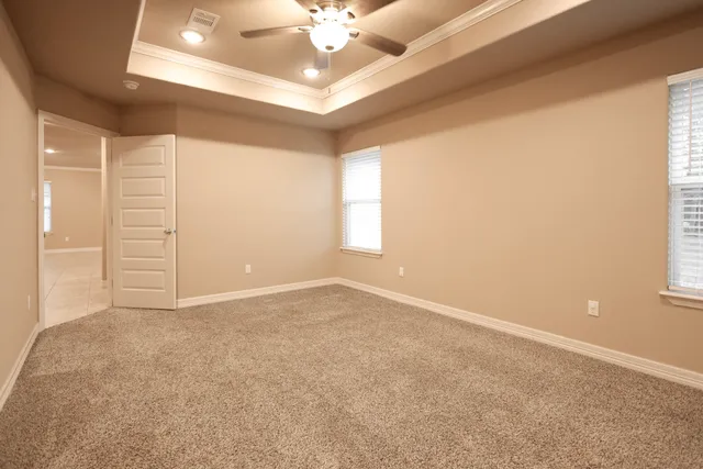 a spacious bathroom with a shower sink and a mirror