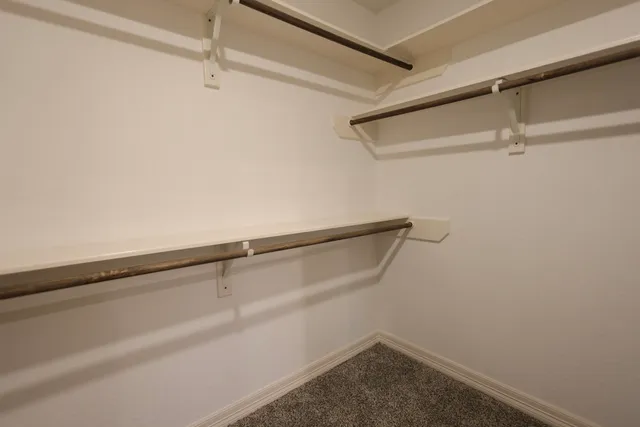 a aerial view of a house with a yard and balcony