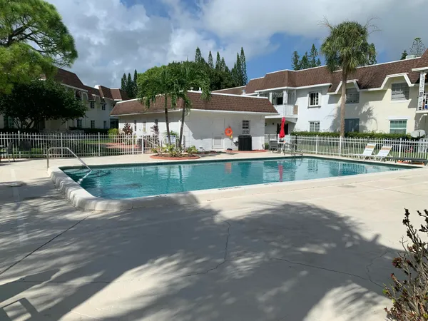 a view of house with a swimming pool