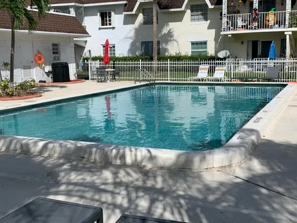 a view of swimming pool with outdoor seating