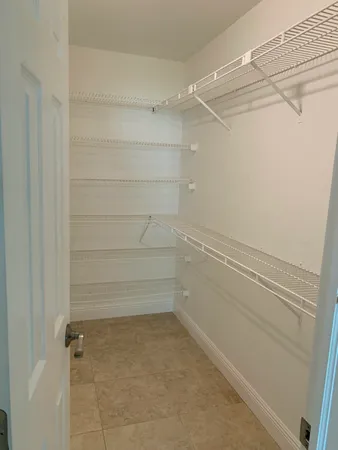 a empty closet with white paint