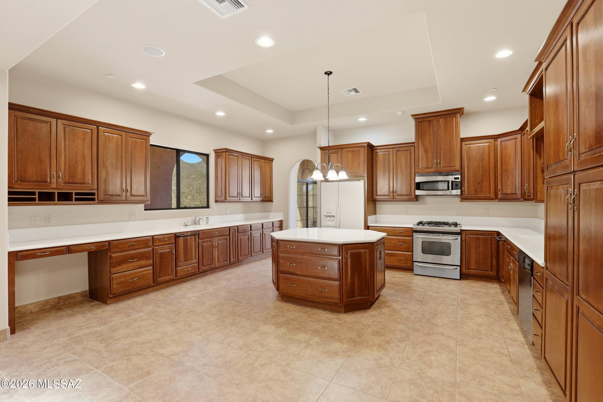 6331 West Trails End Road Tucson, AZ 85745 - Photo 10 of 41 a large kitchen with stainless steel appliances lots of counter top space