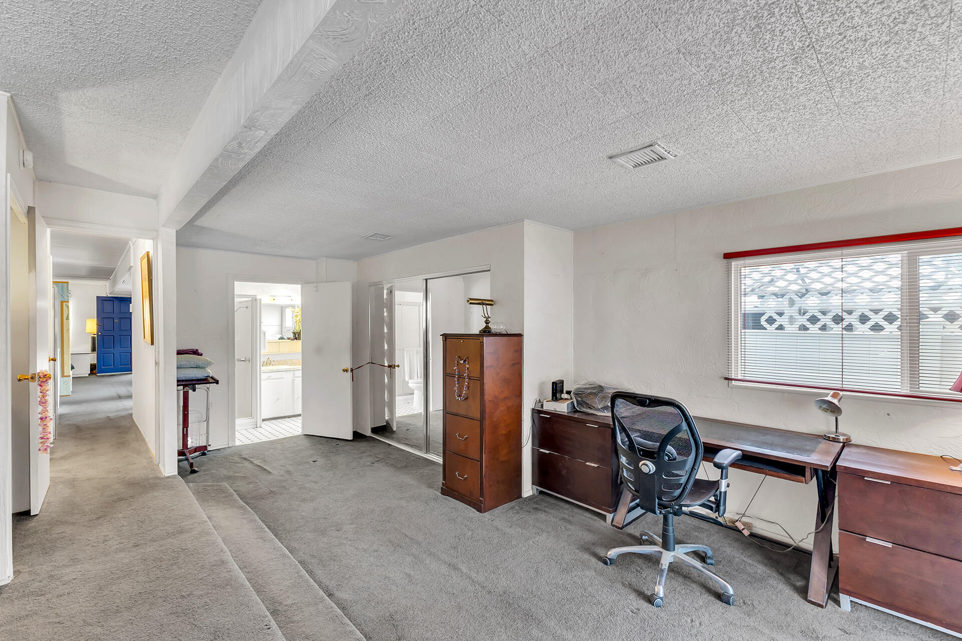 219 Stone Terrace Palm Springs, CA 92264 - Photo 17 of 41 a view of a livingroom with workspace and a window