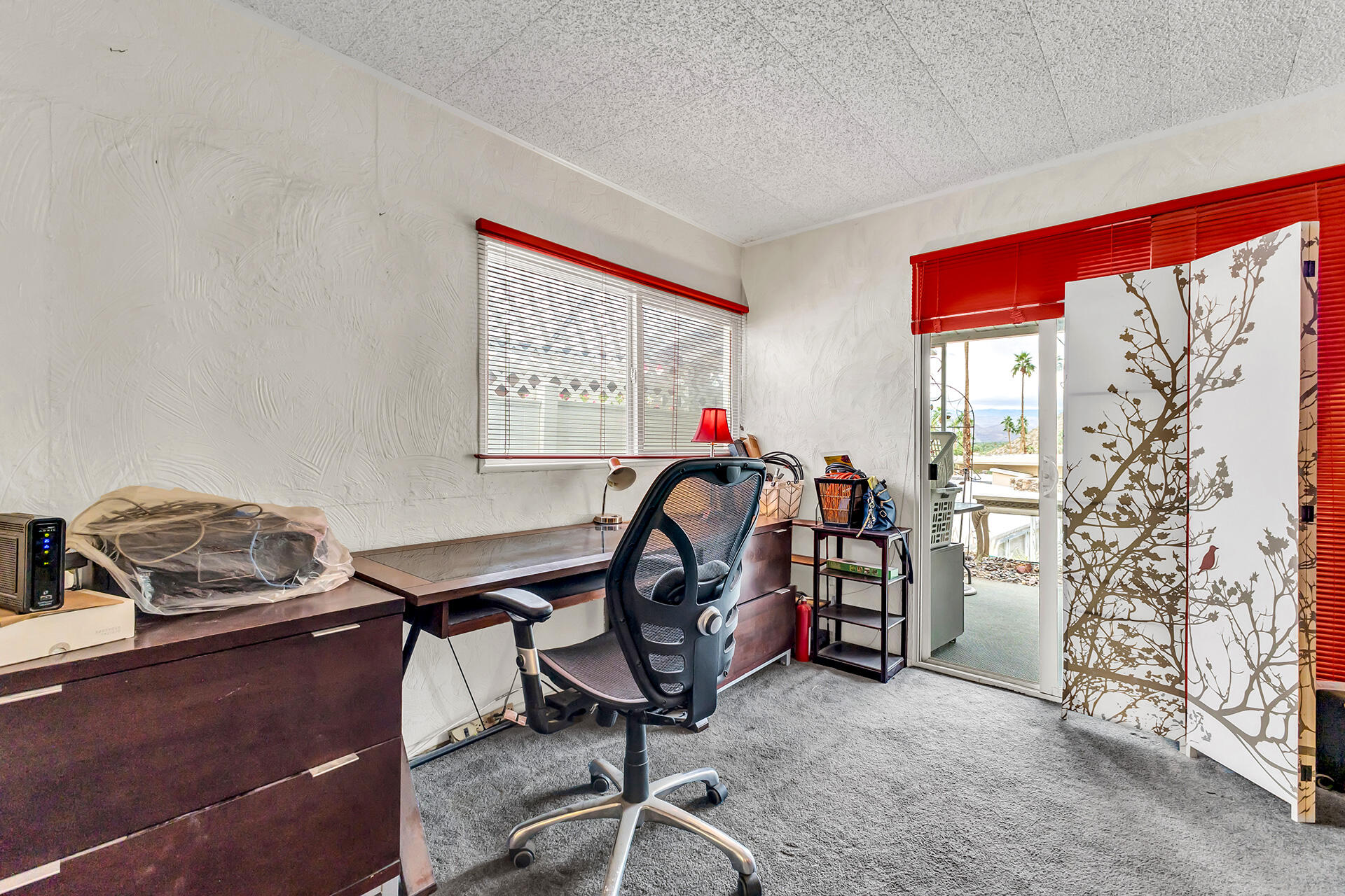 219 Stone Terrace Palm Springs, CA 92264 - Photo 18 of 41 a view of a room with gym equipment