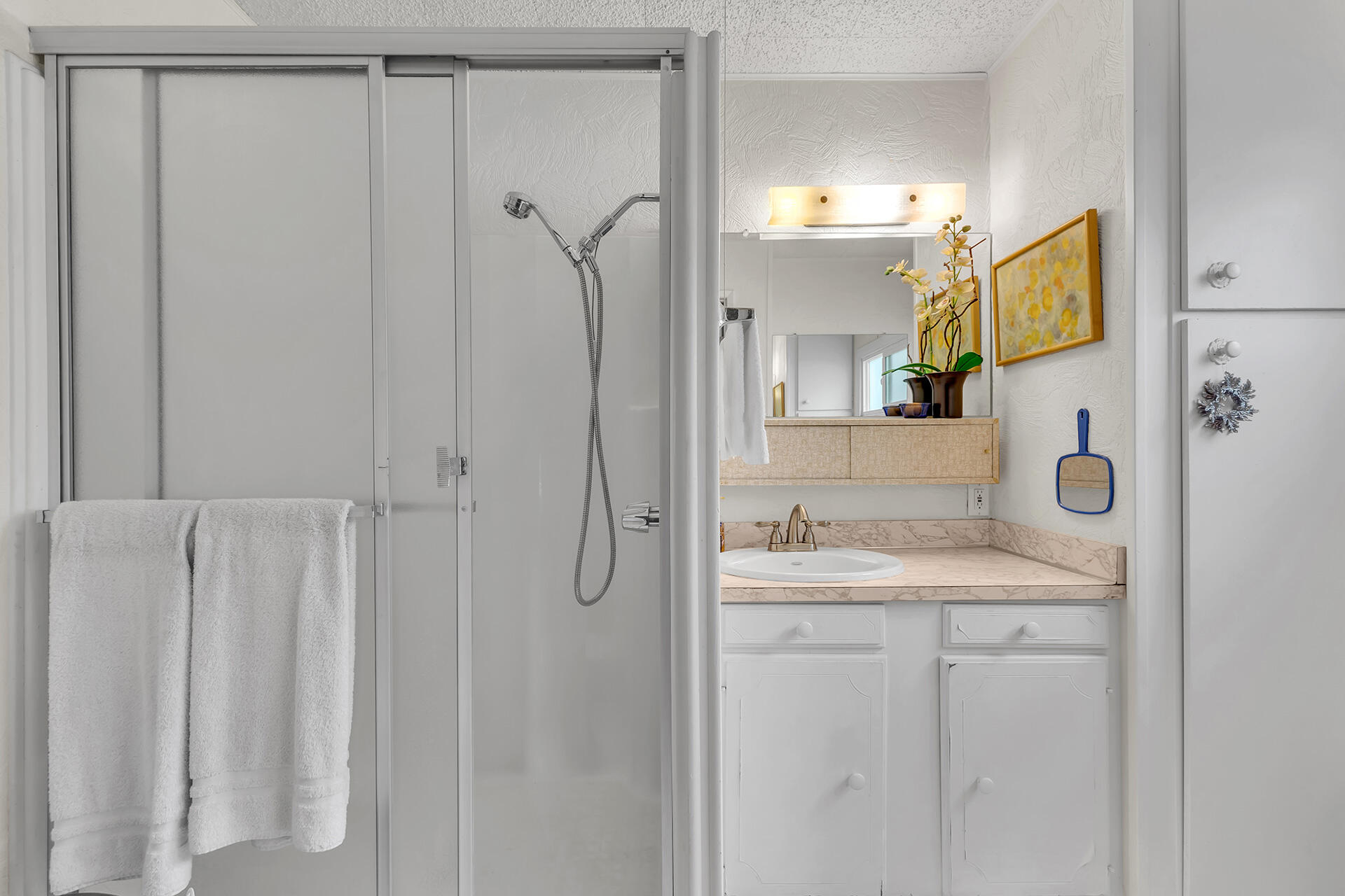 219 Stone Terrace Palm Springs, CA 92264 - Photo 19 of 41 a bathroom with a sink and mirror