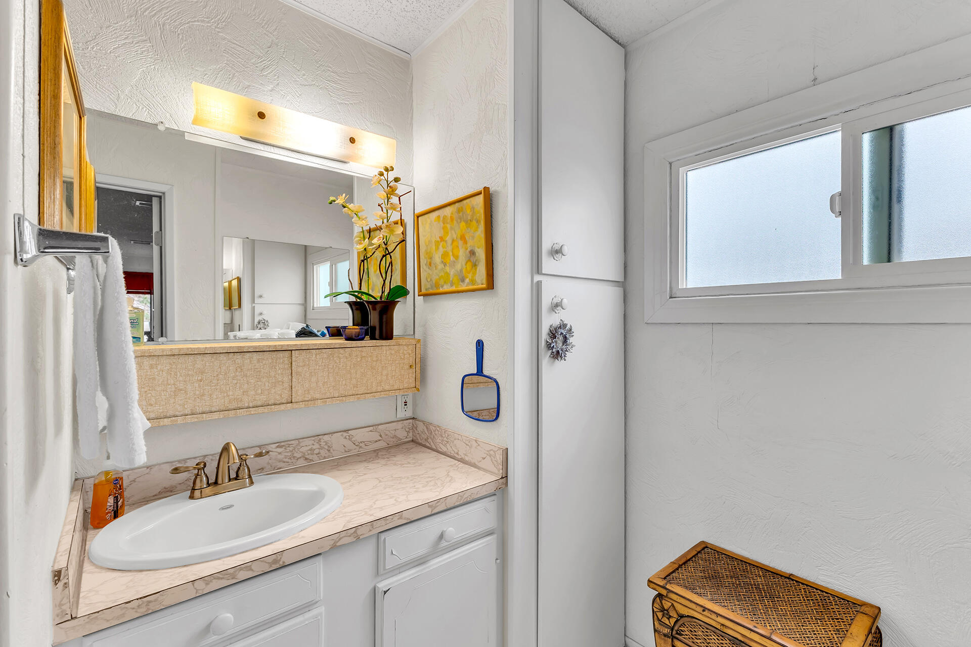 219 Stone Terrace Palm Springs, CA 92264 - Photo 20 of 41 a bathroom with a sink and a mirror