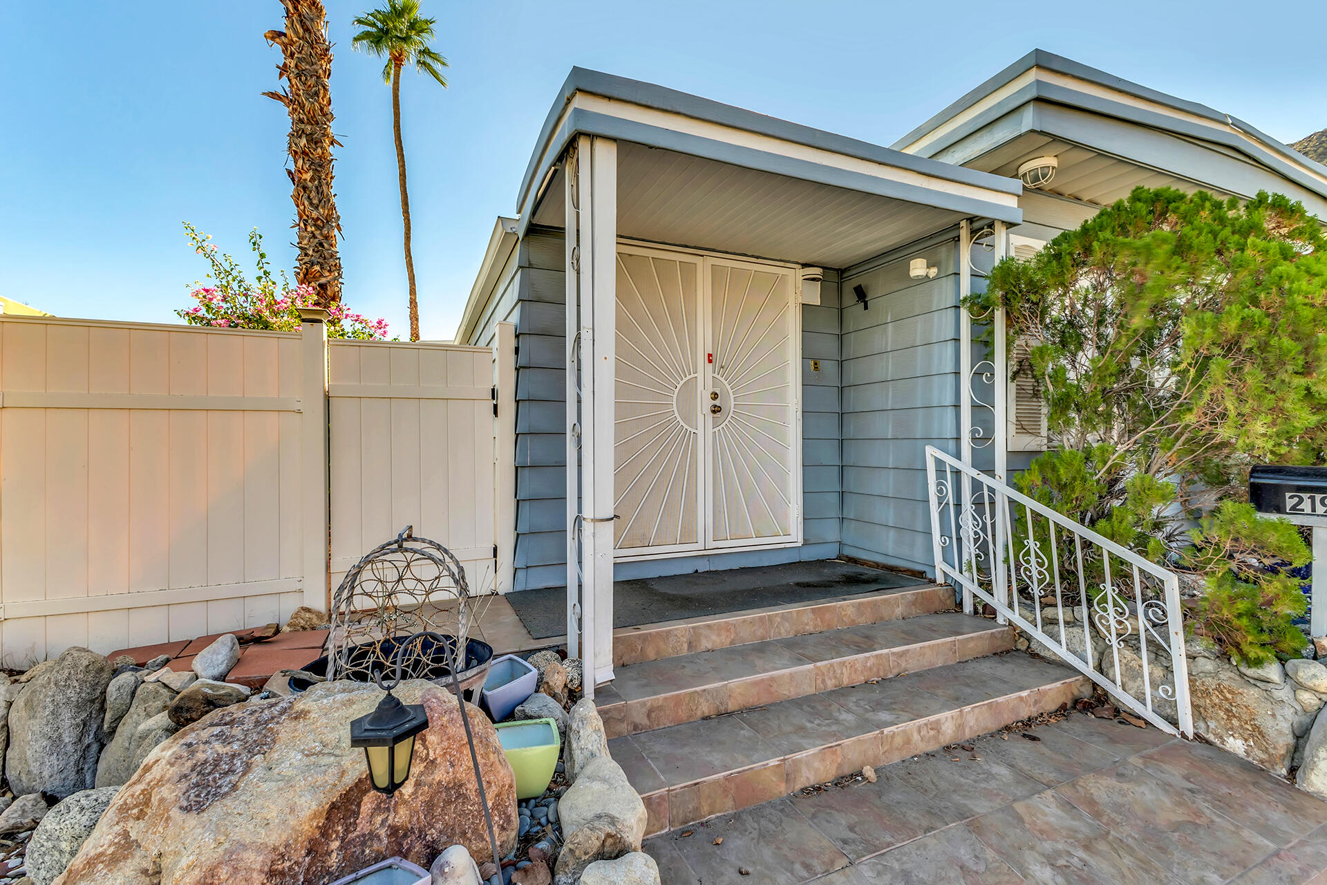 219 Stone Terrace Palm Springs, CA 92264 - Photo 24 of 41 a view of a house with a window and wooden walls