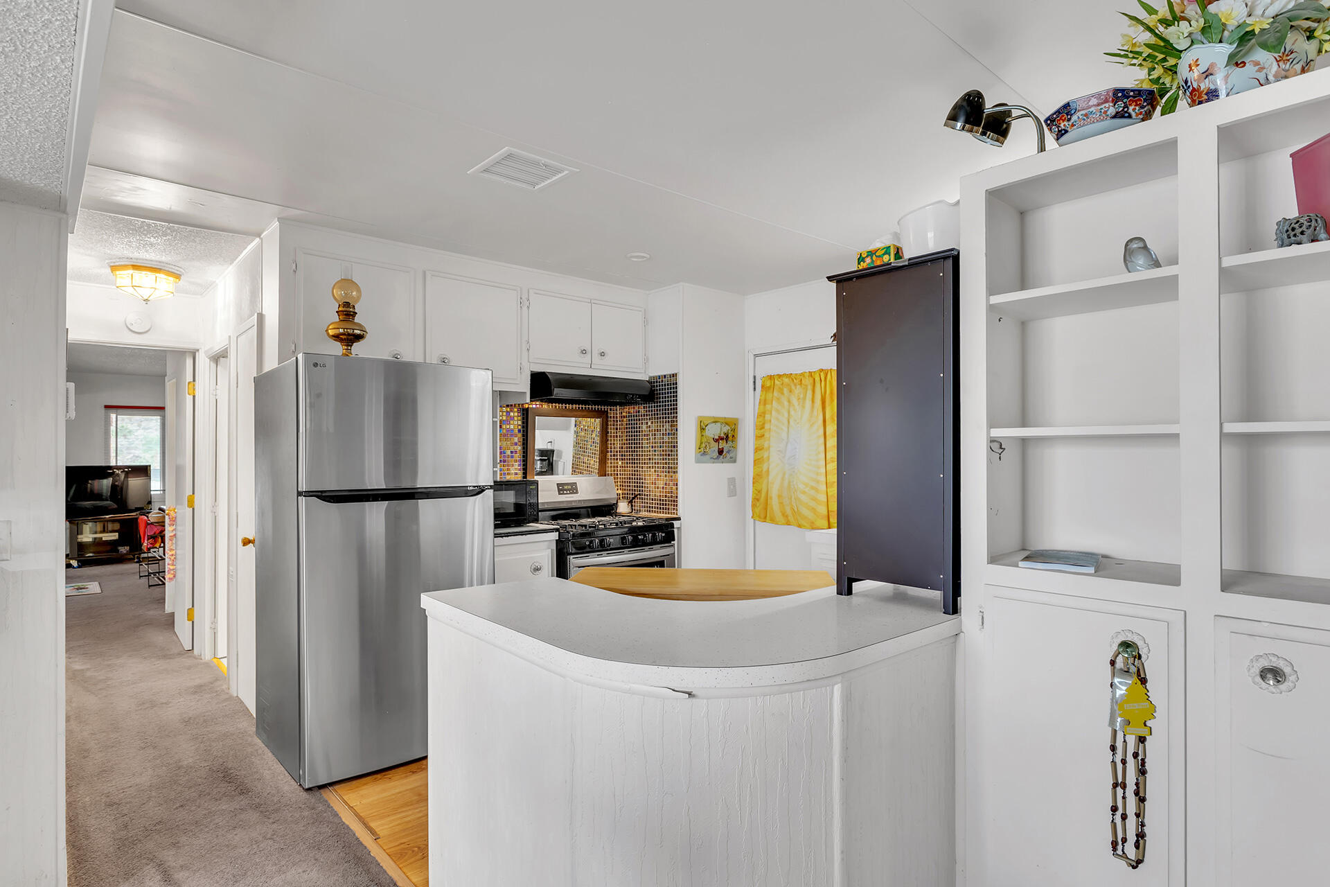 219 Stone Terrace Palm Springs, CA 92264 - Photo 29 of 41 a kitchen with a refrigerator a stove and a sink
