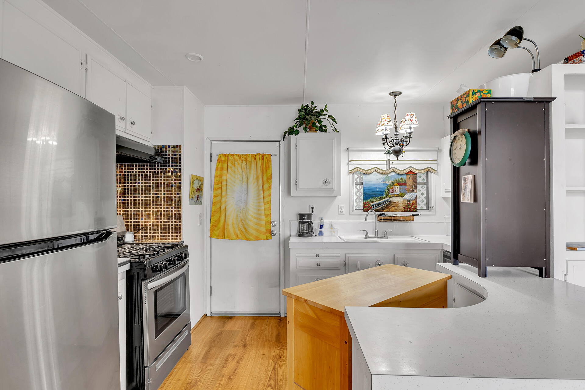 219 Stone Terrace Palm Springs, CA 92264 - Photo 30 of 41 a kitchen with a refrigerator and a sink
