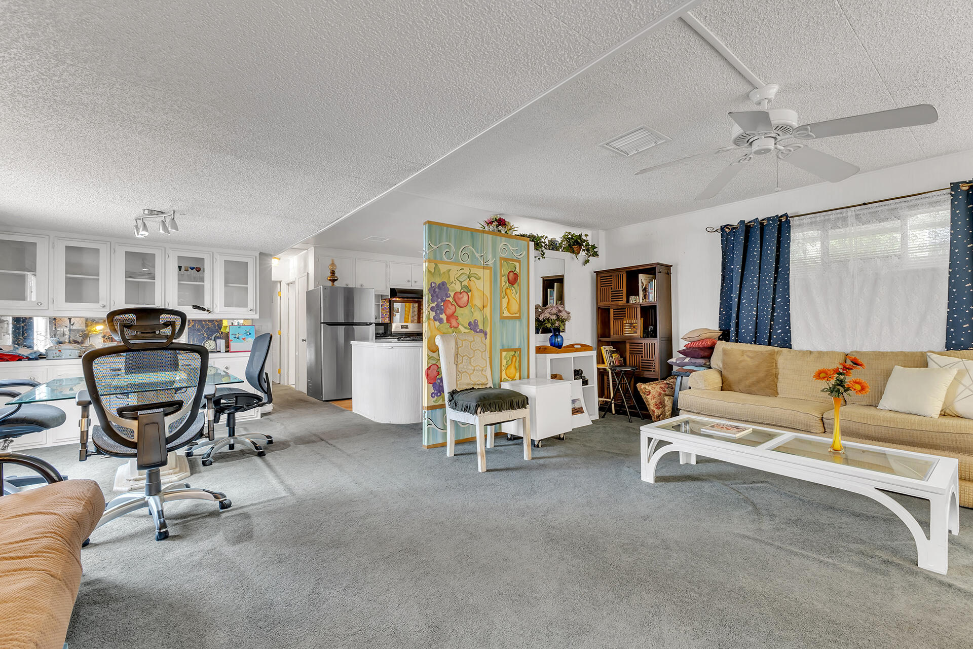 219 Stone Terrace Palm Springs, CA 92264 - Photo 3 of 41 a living room with furniture and a gym machine